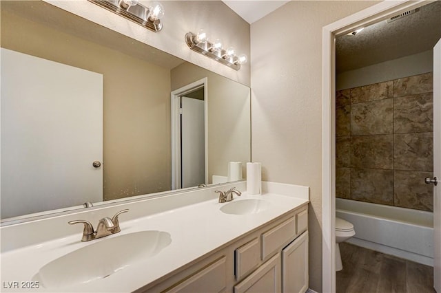 1620 Yellow Rose St, Las Vegas, NV 89108 - bathroom featuring toilet, wood finished floors, and double vanity