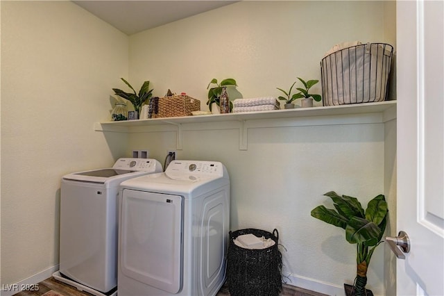 8335 Beaten Path Ct, Las Vegas, NV 89166 - laundry room with independent washer and dryer, baseboards, and wood finished floors