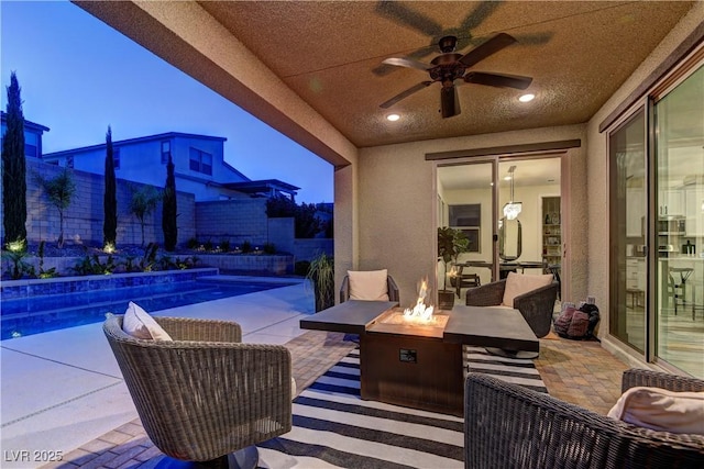 8335 Beaten Path Ct, Las Vegas, NV 89166 - view of patio / terrace with an outdoor fire pit, ceiling fan, and a fenced backyard