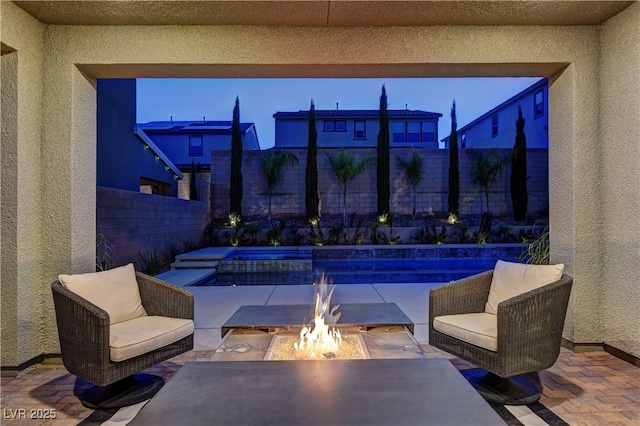 8335 Beaten Path Ct, Las Vegas, NV 89166 - view of patio / terrace with an outdoor fire pit and a fenced backyard
