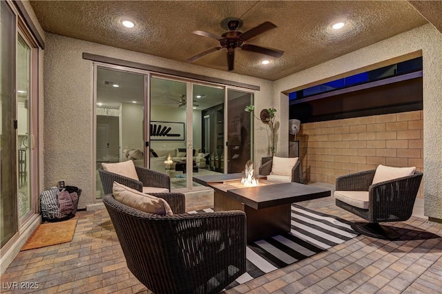 8335 Beaten Path Ct, Las Vegas, NV 89166 - view of patio with a ceiling fan and an outdoor living space with a fire pit