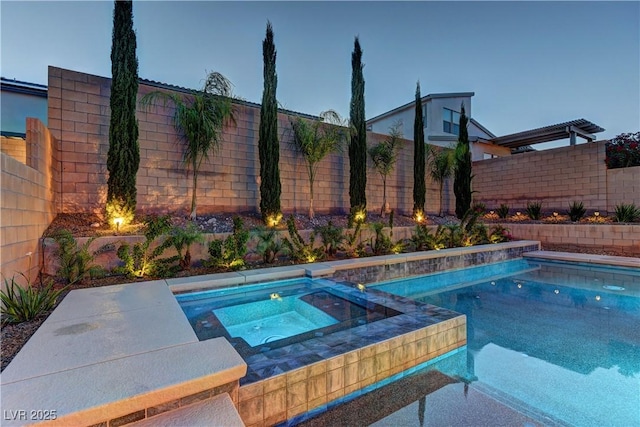 8335 Beaten Path Ct, Las Vegas, NV 89166 - view of swimming pool with an in-ground hot tub and a fenced backyard