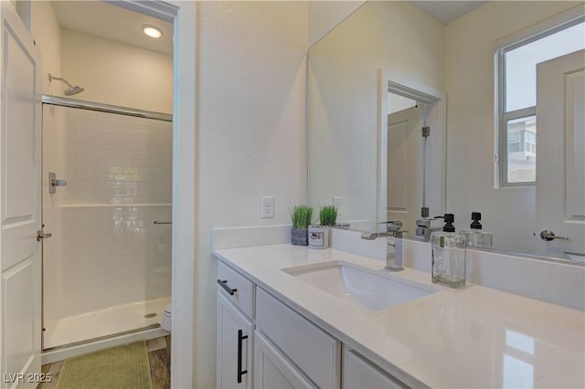 8335 Beaten Path Ct, Las Vegas, NV 89166 - bathroom with a shower stall, toilet, vanity, and recessed lighting