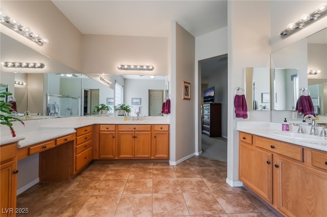 8125 Soledad Canyon St, Las Vegas, NV 89131 - bathroom with a shower with door, two vanities, tile patterned floors, and baseboards