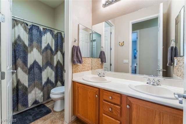 8125 Soledad Canyon St, Las Vegas, NV 89131 - full bathroom featuring toilet, double vanity, decorative backsplash, tile patterned floors, and curtained shower