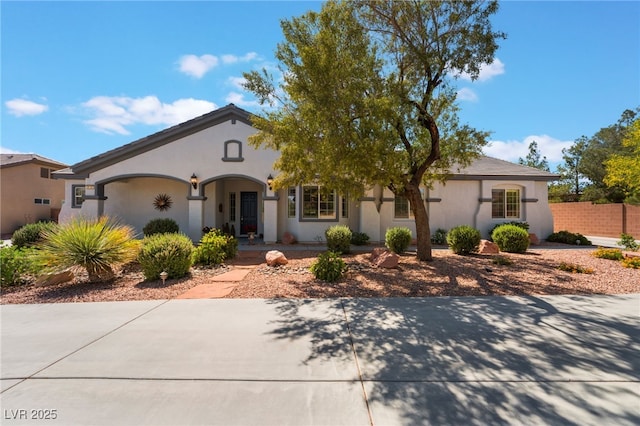 8125 Soledad Canyon St, Las Vegas, NV 89131 - view of front of house featuring stucco siding and fence