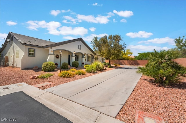 8125 Soledad Canyon St, Las Vegas, NV 89131 - view of front of house featuring fence, stucco siding, and concrete driveway