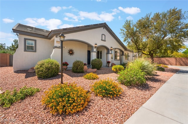 8125 Soledad Canyon St, Las Vegas, NV 89131 - view of front facade with fence and stucco siding