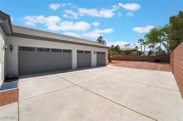 8125 Soledad Canyon St, Las Vegas, NV 89131 - garage featuring driveway and fence
