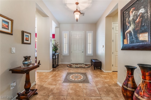 8125 Soledad Canyon St, Las Vegas, NV 89131 - entrance foyer with light tile patterned flooring and baseboards