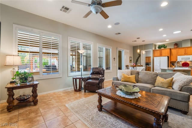 8125 Soledad Canyon St, Las Vegas, NV 89131 - living area featuring a ceiling fan, recessed lighting, light tile patterned floors, and baseboards