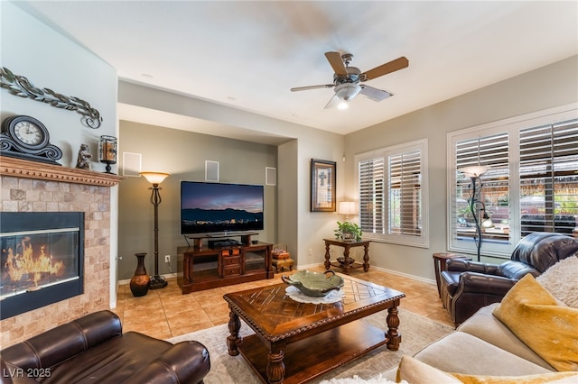 8125 Soledad Canyon St, Las Vegas, NV 89131 - tiled living area with ceiling fan, plenty of natural light, baseboards, and a glass covered fireplace