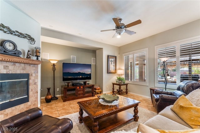 8125 Soledad Canyon St, Las Vegas, NV 89131 - tiled living area featuring ceiling fan, plenty of natural light, baseboards, and a glass covered fireplace