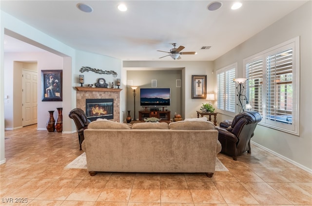 8125 Soledad Canyon St, Las Vegas, NV 89131 - living room featuring a ceiling fan, a tiled fireplace, baseboards, light tile patterned flooring, and recessed lighting