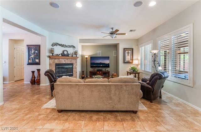 8125 Soledad Canyon St, Las Vegas, NV 89131 - living area featuring a tile fireplace, ceiling fan, baseboards, light tile patterned floors, and recessed lighting
