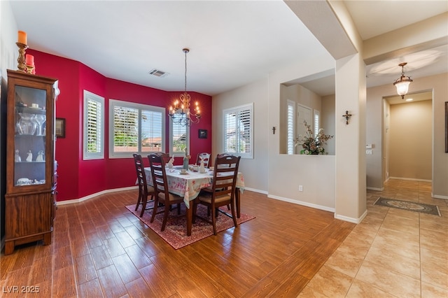 8125 Soledad Canyon St, Las Vegas, NV 89131 - dining space with wood finished floors, a chandelier, and baseboards