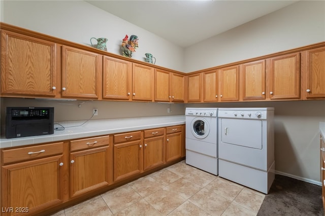 8125 Soledad Canyon St, Las Vegas, NV 89131 - laundry area featuring washing machine and clothes dryer, cabinet space, and light tile patterned floors