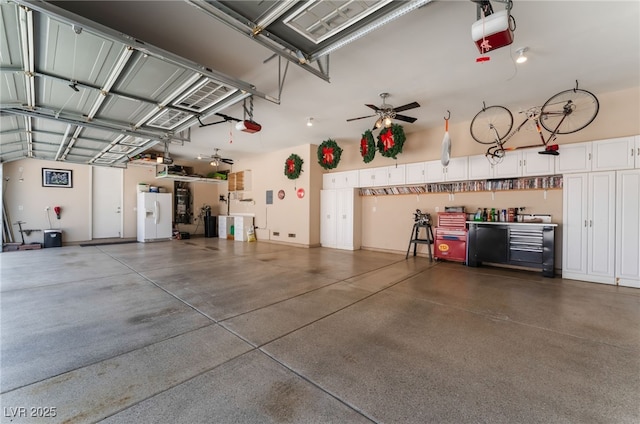 8125 Soledad Canyon St, Las Vegas, NV 89131 - garage featuring white refrigerator with ice dispenser and a garage door opener
