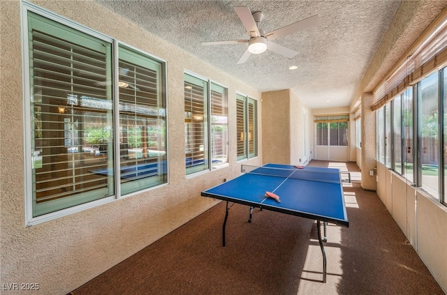 8125 Soledad Canyon St, Las Vegas, NV 89131 - recreation room featuring carpet flooring, a textured wall, a textured ceiling, and a ceiling fan