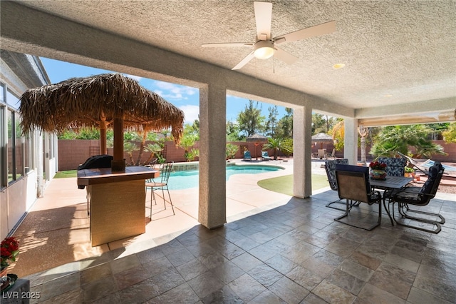 8125 Soledad Canyon St, Las Vegas, NV 89131 - view of patio / terrace featuring outdoor dining space, a fenced backyard, and ceiling fan