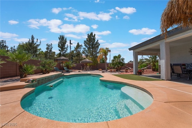 8125 Soledad Canyon St, Las Vegas, NV 89131 - view of swimming pool featuring a patio and a fenced backyard