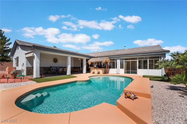 8125 Soledad Canyon St, Las Vegas, NV 89131 - rear view of house with a patio area, a sunroom, and stucco siding