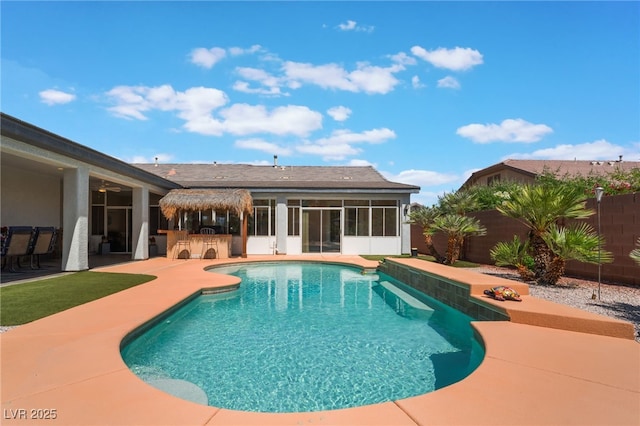 8125 Soledad Canyon St, Las Vegas, NV 89131 - view of pool featuring a sunroom, a fenced backyard, and a patio area