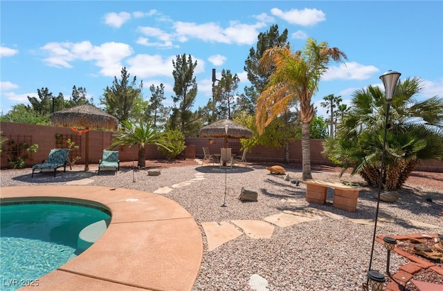 8125 Soledad Canyon St, Las Vegas, NV 89131 - view of swimming pool featuring a patio area and a fenced backyard
