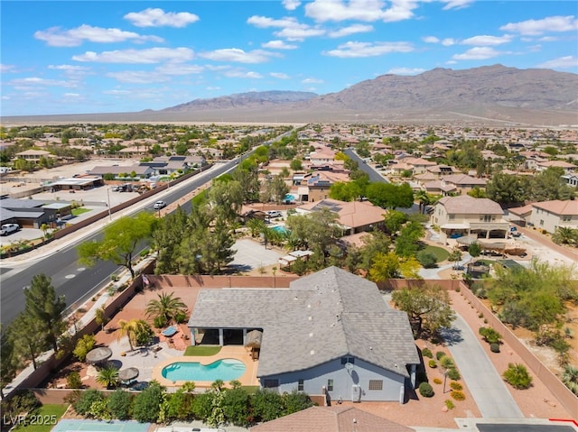 8125 Soledad Canyon St, Las Vegas, NV 89131 - aerial perspective of suburban area featuring a mountainous background and a pool