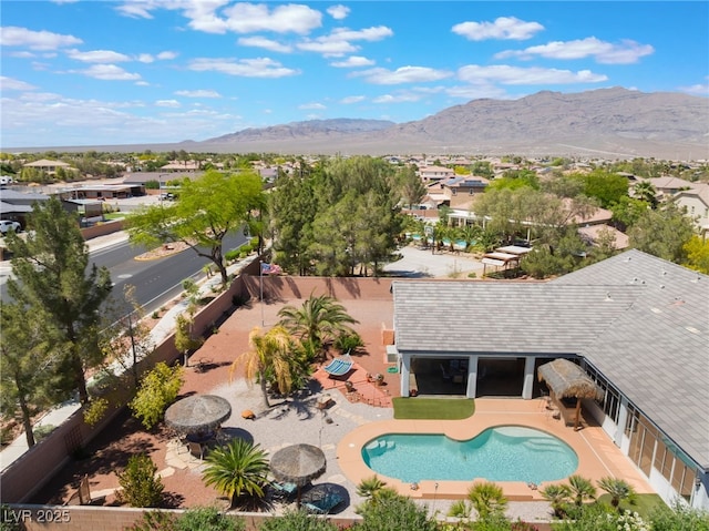 8125 Soledad Canyon St, Las Vegas, NV 89131 - view of swimming pool featuring a mountain view, a patio, and a residential view