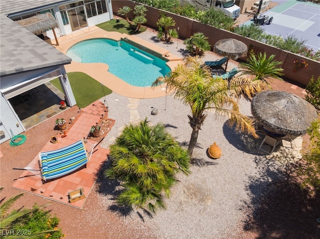 8125 Soledad Canyon St, Las Vegas, NV 89131 - view of swimming pool featuring a patio and a fenced backyard