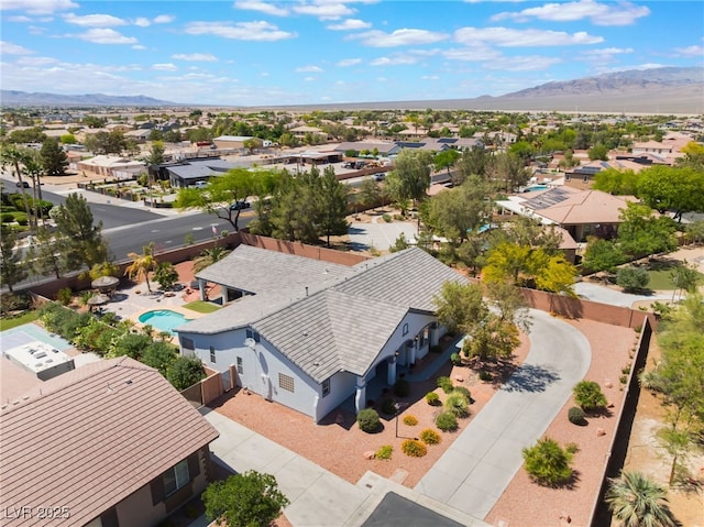 8125 Soledad Canyon St, Las Vegas, NV 89131 - aerial perspective of suburban area featuring a mountainous background and a pool area