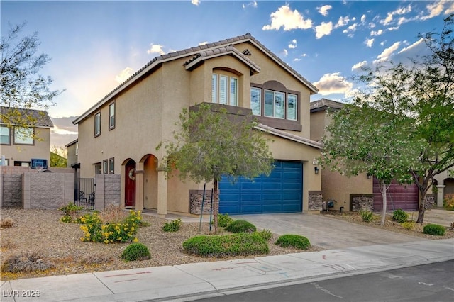 9327 S Chieftain St, Las Vegas, NV 89178 - view of front facade featuring a garage, stucco siding, fence, and a gate
