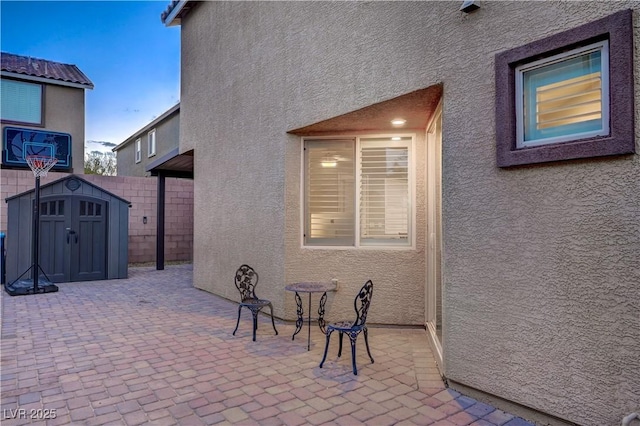 9327 S Chieftain St, Las Vegas, NV 89178 - view of patio featuring a shed and an outbuilding