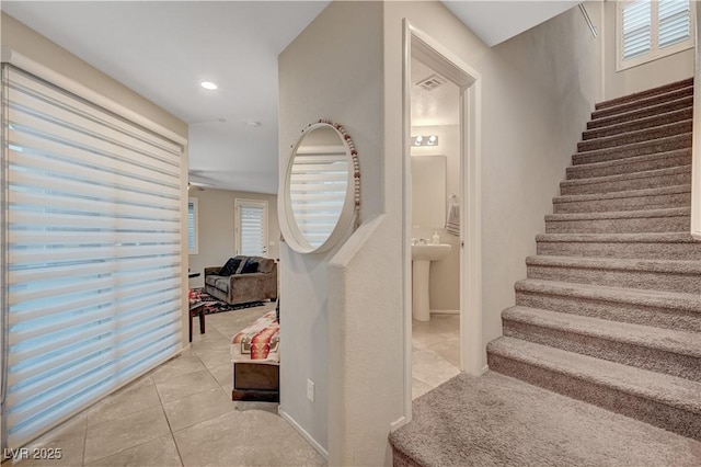 9327 S Chieftain St, Las Vegas, NV 89178 - stairs featuring tile patterned floors, healthy amount of natural light, and recessed lighting