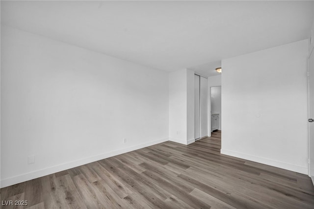 1424 Santa Anita Dr Unit D, Las Vegas, NV 89119 - unfurnished room featuring wood finished floors and baseboards