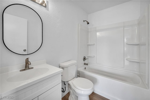1424 Santa Anita Dr Unit D, Las Vegas, NV 89119 - bathroom with toilet, vanity, wood finished floors, and shower / washtub combination