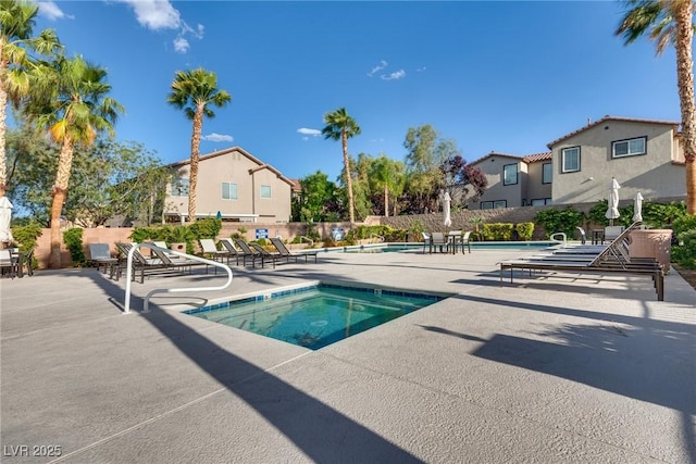 680 Moonlight Stroll St, Henderson, NV 89002 - community pool featuring a patio area, a community hot tub, a residential view, and fence