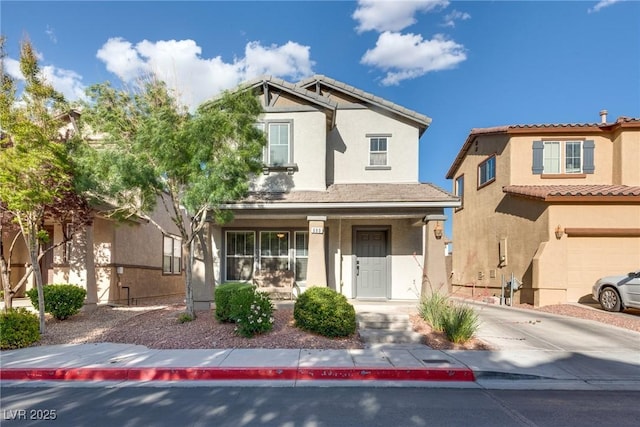 680 Moonlight Stroll St, Henderson, NV 89002 - view of front facade featuring covered porch, stucco siding, and driveway