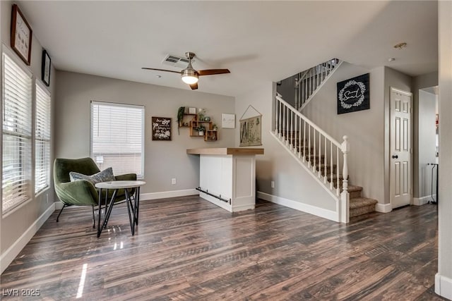 680 Moonlight Stroll St, Henderson, NV 89002 - living area with wood finished floors, stairs, a ceiling fan, and baseboards