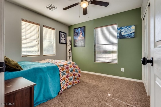 680 Moonlight Stroll St, Henderson, NV 89002 - carpeted bedroom featuring multiple windows, a closet, baseboards, and ceiling fan