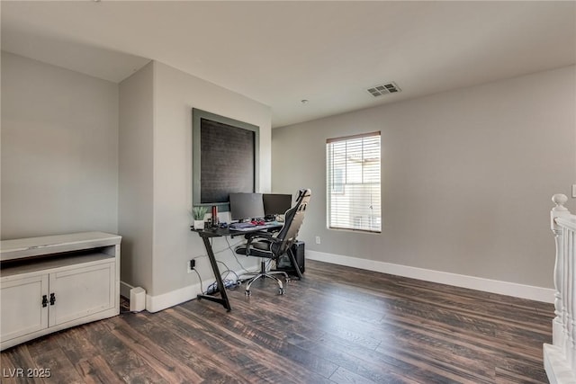 680 Moonlight Stroll St, Henderson, NV 89002 - home office featuring dark wood finished floors and baseboards