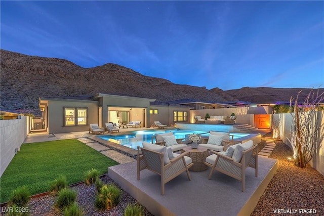 10048 Copper Edge Rd, Las Vegas, NV 89148 - view of swimming pool with an outdoor living space, a mountain view, and a fenced backyard