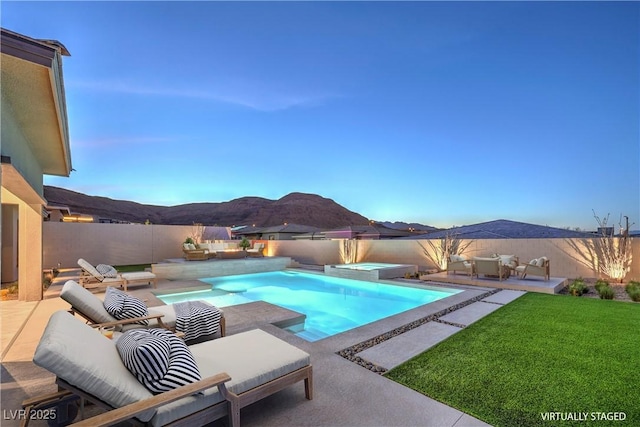 10048 Copper Edge Rd, Las Vegas, NV 89148 - view of swimming pool with a mountain view, an in-ground hot tub, a fenced backyard, and a patio area