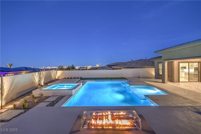 10048 Copper Edge Rd, Las Vegas, NV 89148 - pool at twilight with a fenced backyard, a patio area, and a pool with connected hot tub
