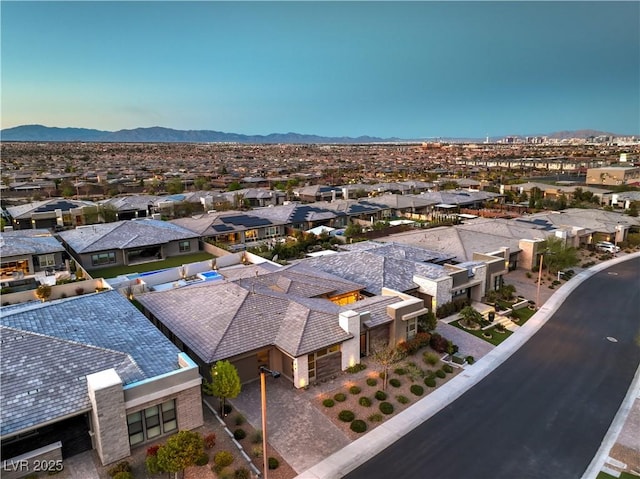 10048 Copper Edge Rd, Las Vegas, NV 89148 - aerial perspective of suburban area with a mountainous background