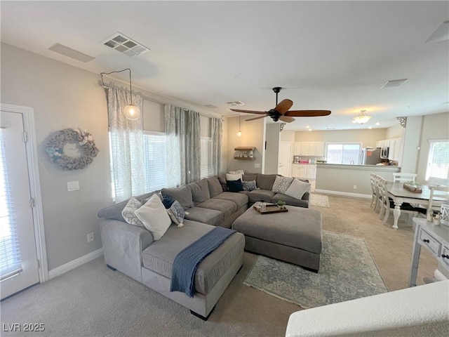 8340 Winterchase Pl, Las Vegas, NV 89143 - living area featuring carpet flooring, ceiling fan, and baseboards