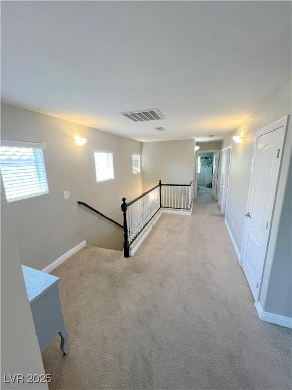 8340 Winterchase Pl, Las Vegas, NV 89143 - hall with an upstairs landing, carpet floors, and baseboards