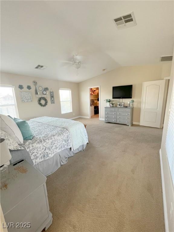 8340 Winterchase Pl, Las Vegas, NV 89143 - carpeted bedroom with a spacious closet, baseboards, vaulted ceiling, ceiling fan, and a closet