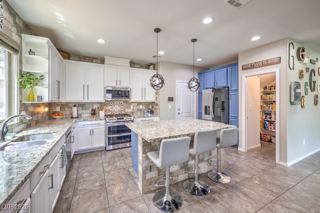 10623 Auburn Springs Ave, Las Vegas, NV 89166 - kitchen with appliances with stainless steel finishes, open shelves, a sink, backsplash, and white cabinets